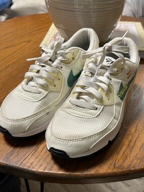 Nike Cream Low-Top Sneakers with Teal Swoosh and Orange Accents